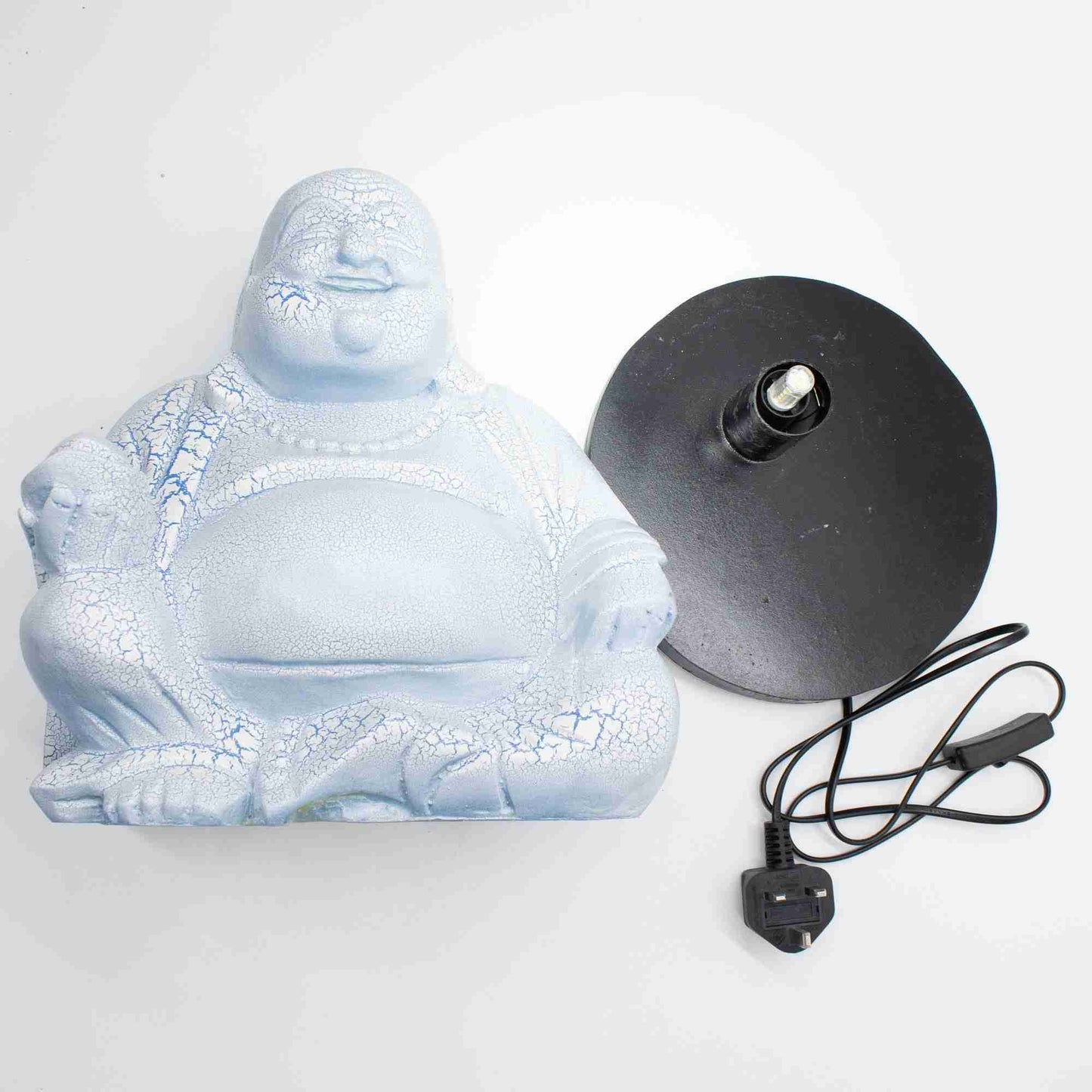 Laughing Buddha Lamp, Sky Blue with black base and power cord on a white background