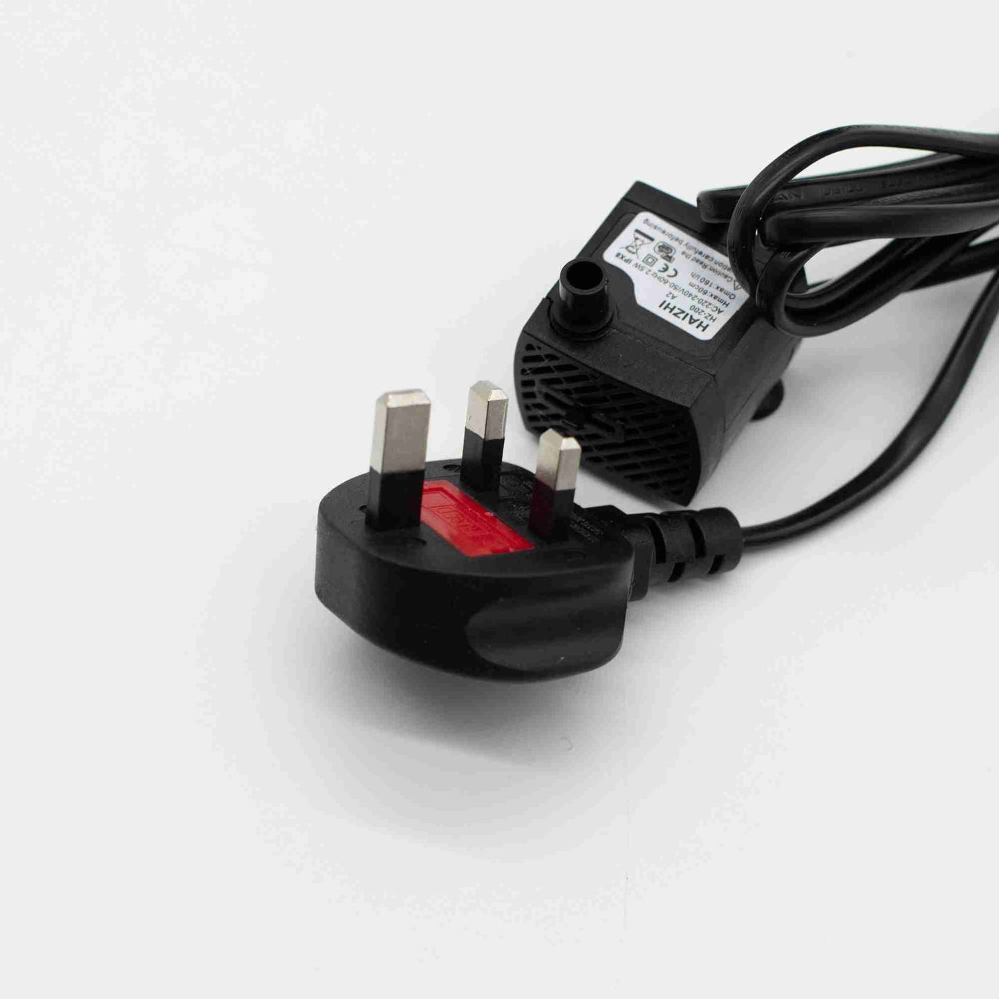 Black power adapter with plug on a white background