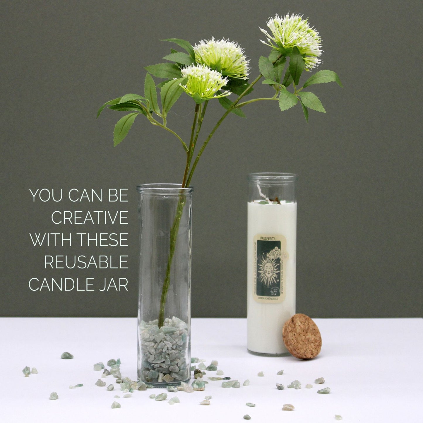 Reusable candle jar with a plant and text on a gray background