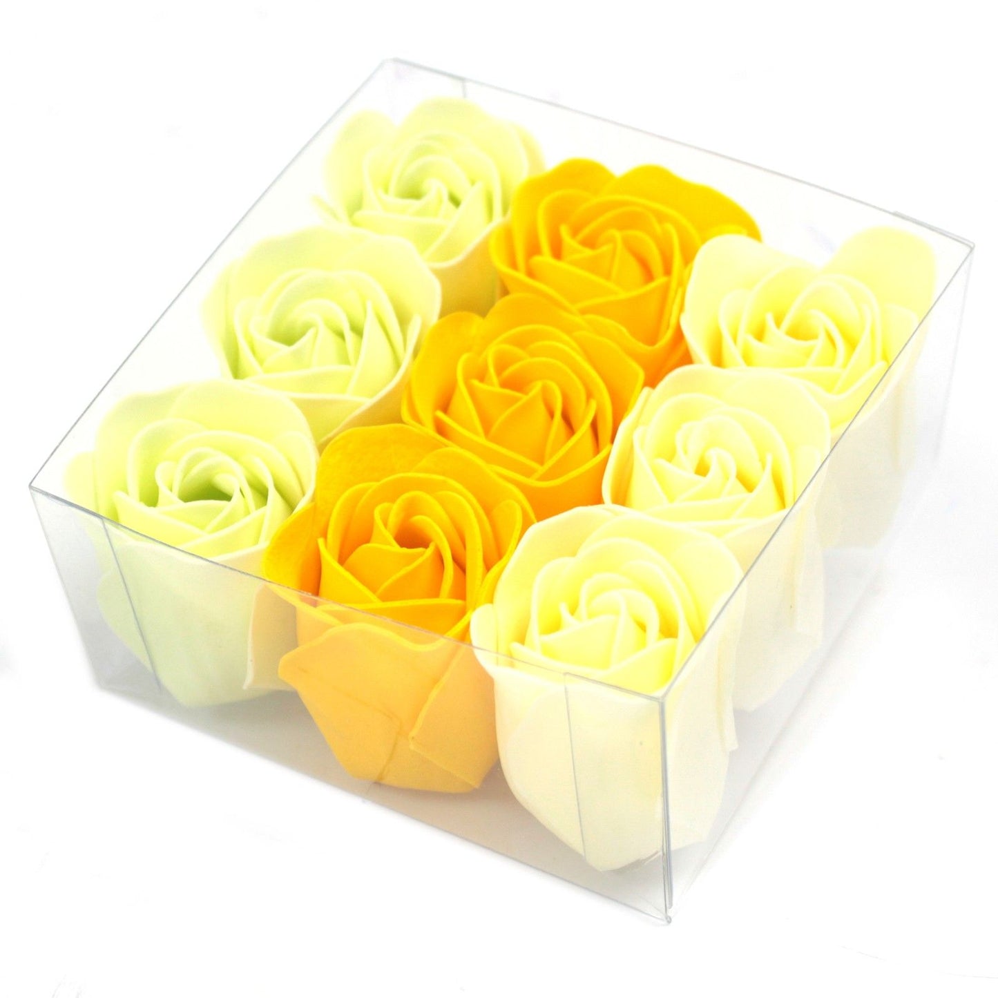 Box of spring colour soap roses with a yellow bow in clear gift box top view