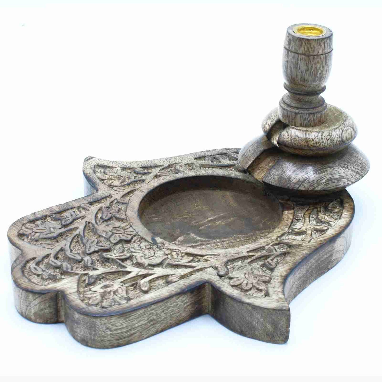 Decorative backflow burner shaped Hamsa hand with intricate carvings on a white background