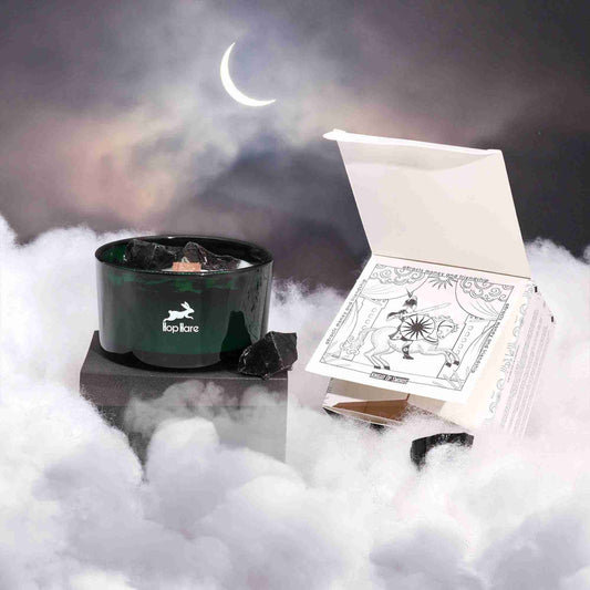 Hop Hare Crystal Magic Flower Candle - The Knight of Swords on a foggy surface with a crescent moon in the background.