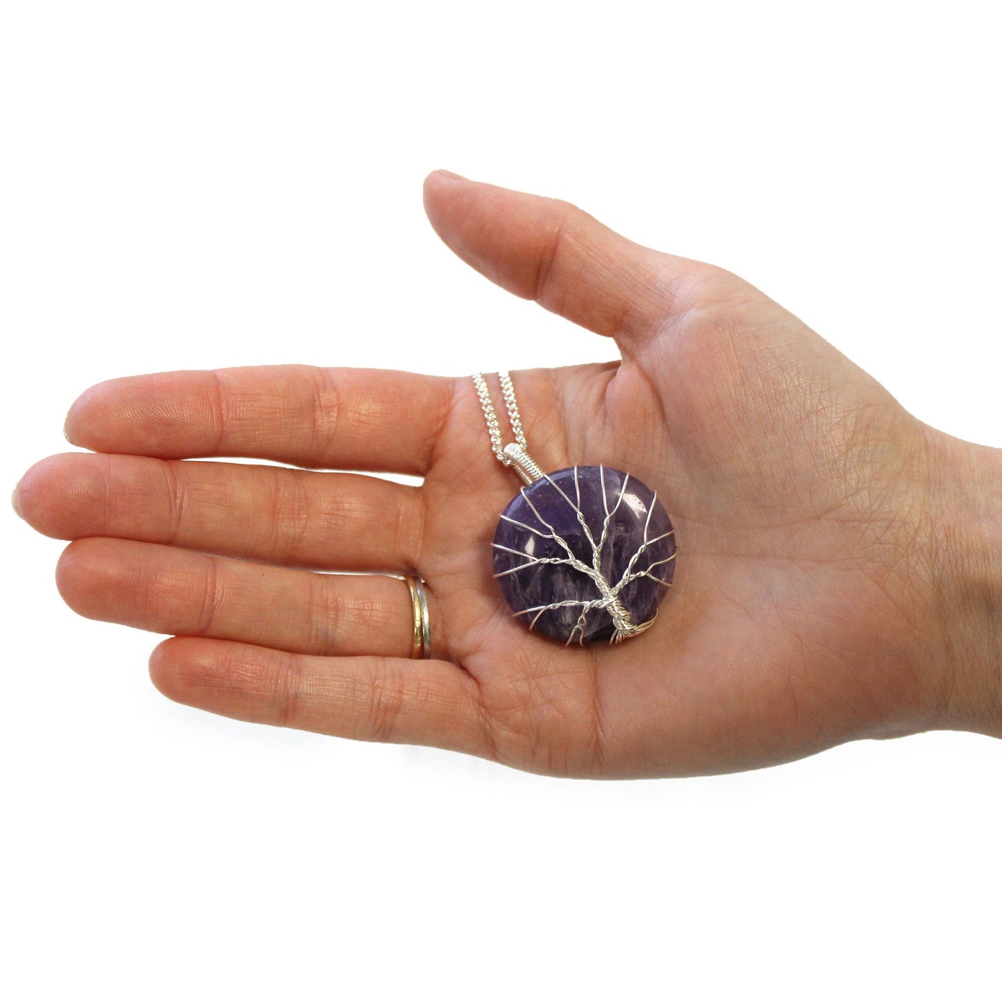 Hand holding Tree of Life Gemstone Necklace - Amethyst