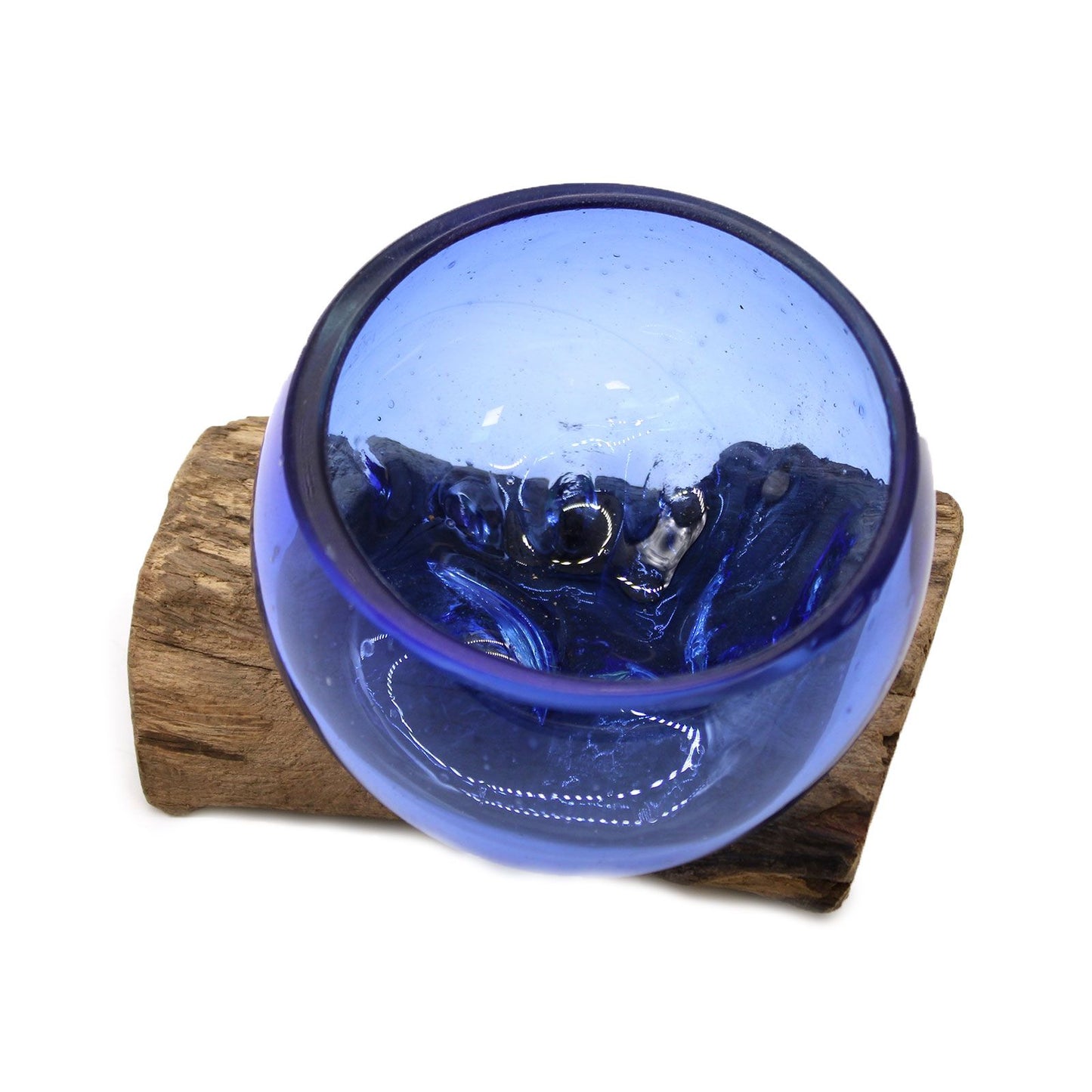 Blue molten glass bowl on a gamal wooden stand with a white background