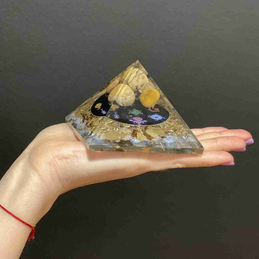 Orgonite Pyramid - Midnight Reiki pleaced on a persons hand