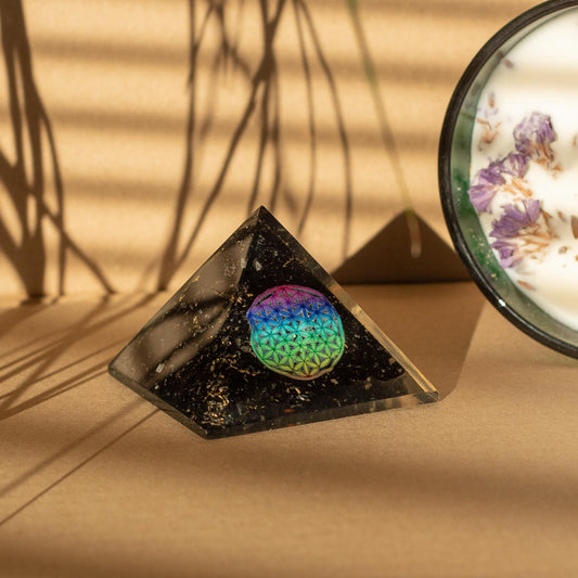 Small Orgonite Pyramids 5.5x4.5cm - Flower of Life - Black Tourmaline Chips with a beige background