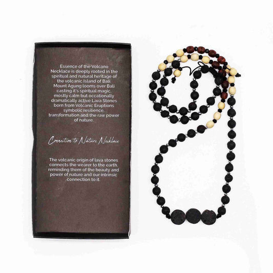 Essence of the Volcano Necklace with a descriptive card on a white background