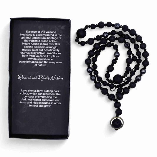 Black beaded necklace with a pendant next to a black box with text on a white background