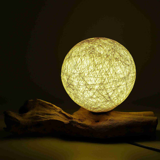 Round woven lamp on a dark background