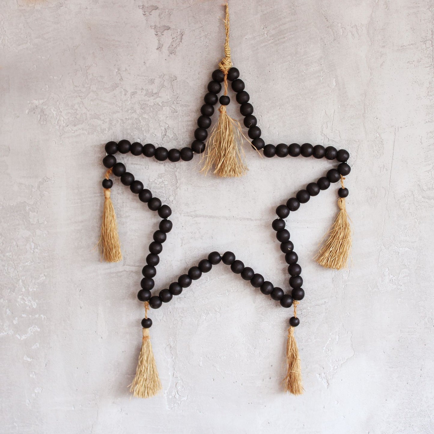Large Bead Star Mobile against a light coloured wall