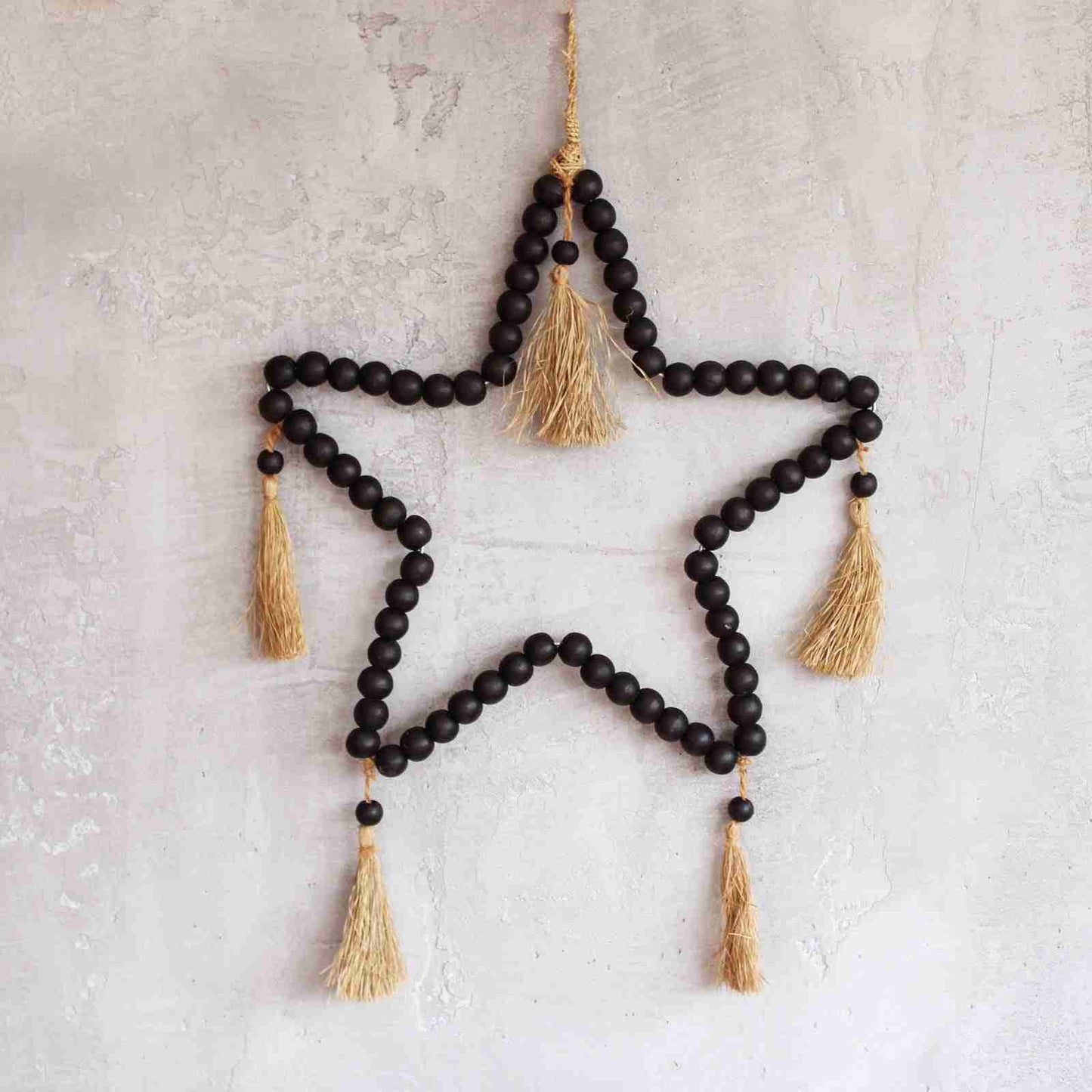 Large Bead Star Mobile against a light coloured wall