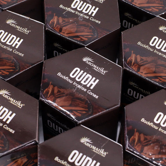 Multiple boxes of Aromatika Oudh Backflow Incense Cones arranged in a pattern.