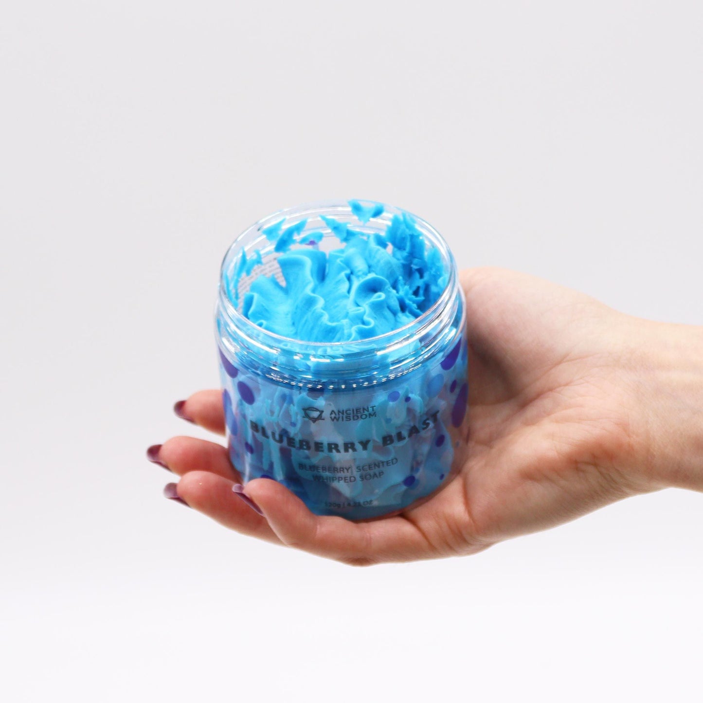 Hand holding a jar of Blueberry Whipped Soap 120g