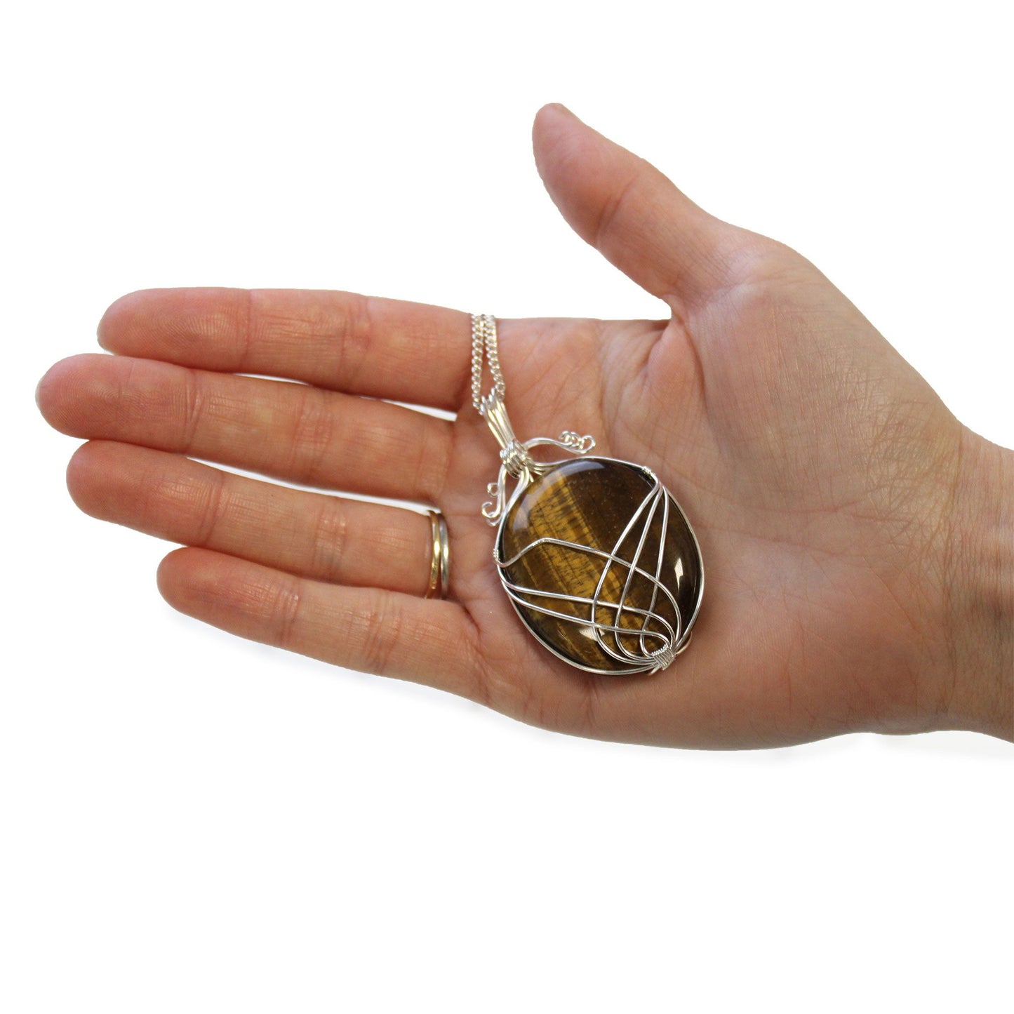 Hand holding Swirl Wrapped Gemstone Necklace - Tiger Eye