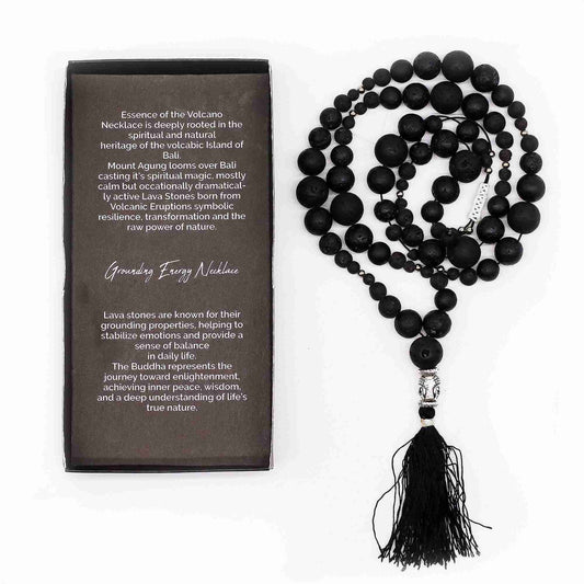 Essence of the Volcano Necklace with tassel next to a description card on a white background