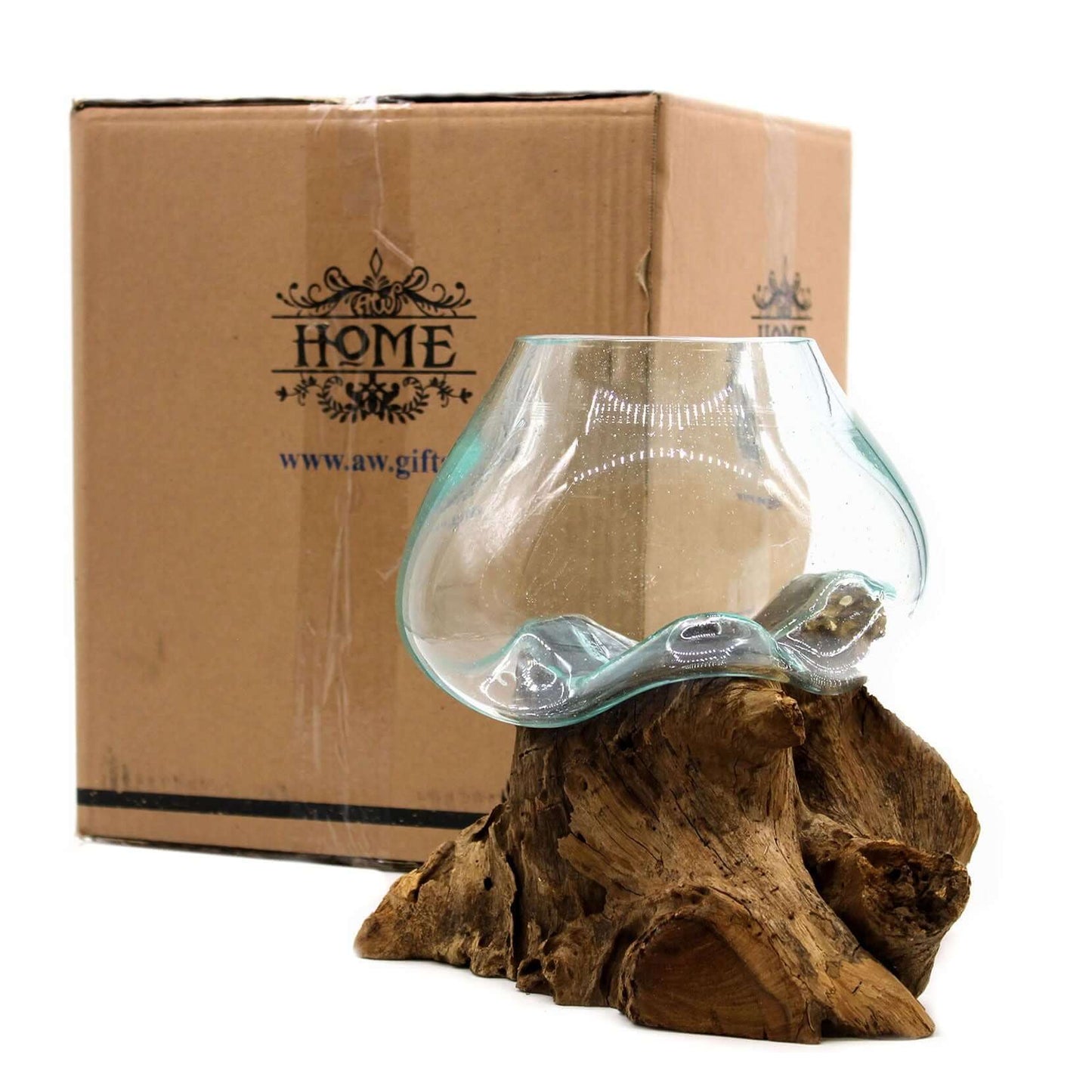 Molten glass bowl on a wooden base with a branded cardboard box in the background