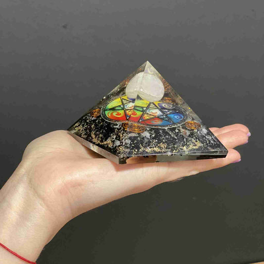 Orgonite Pyramid - Midnight Pentagon held in a persons hand