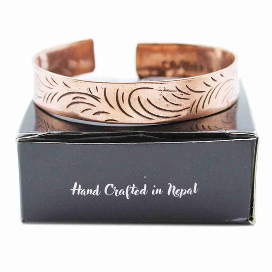 Copper Tibetan Bracelet - Wide Tribal Swirls on a black box with 'Hand Crafted in Nepal' text