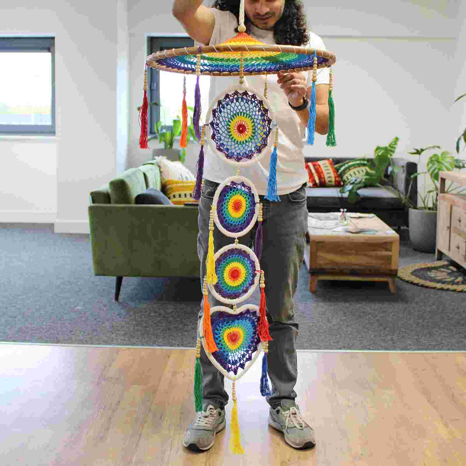Person holding an Extra Large Drama Dreamcatcher Vivid Rainbow in an indoor setting