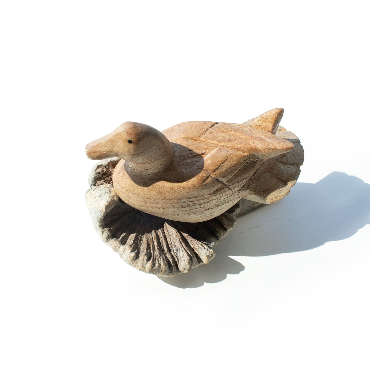 Handmade Parasite Wood Art Carving Wild Duck Resting on a white background, Top view
