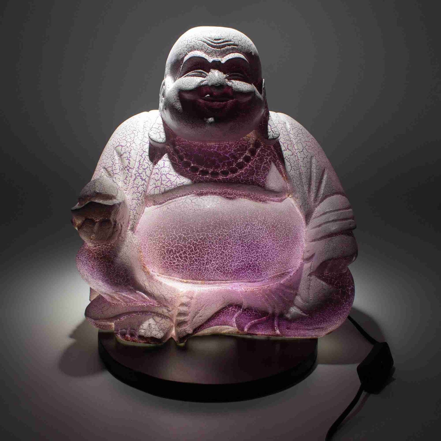 Laughing Buddha Lamp, Lavender Crackle on a dark background.
