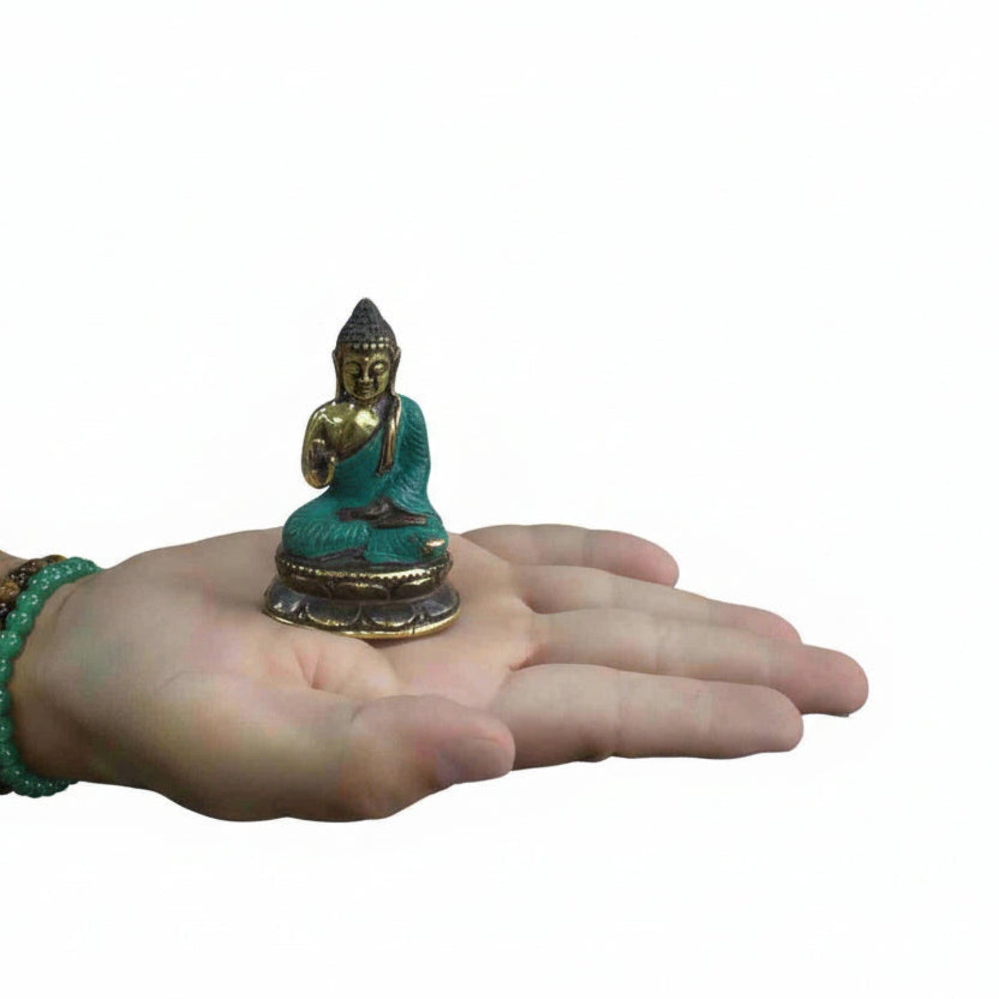 Hand holding a Mini Hand Up Sitting Buddha Brass Figurine