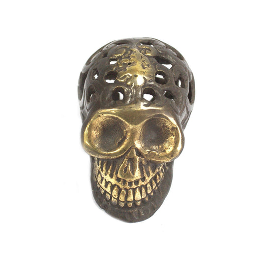 Small Vintage Brass Skull Figurine on a white background, front view.