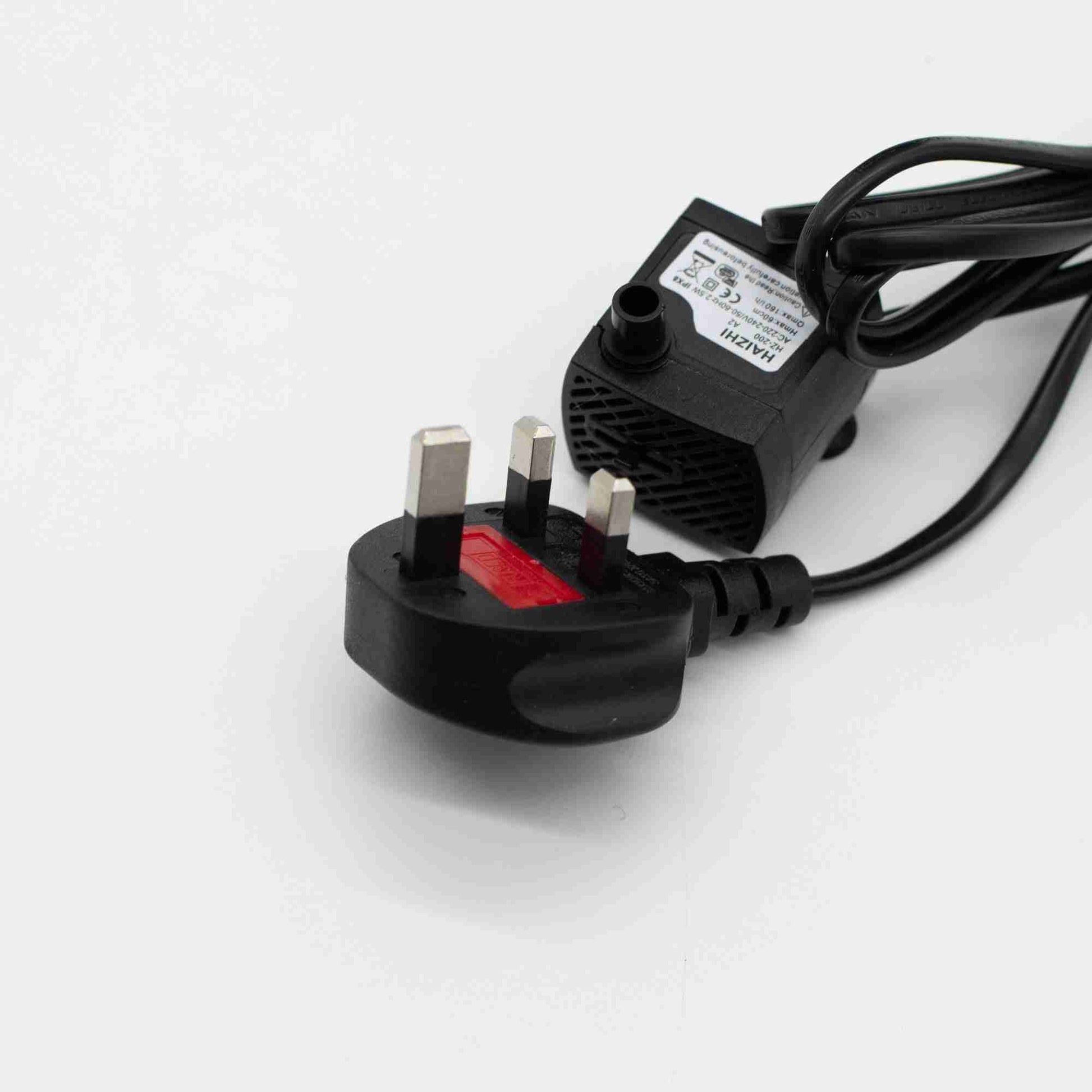 Black power adapter with plug on a white background