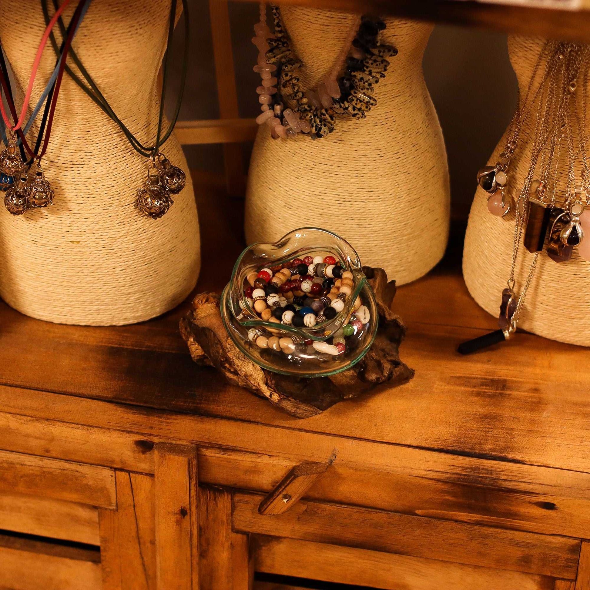 Molten Glass Wavy Bowl on Wood 18cm with beaded necklaes inside bowl on a wooden surface