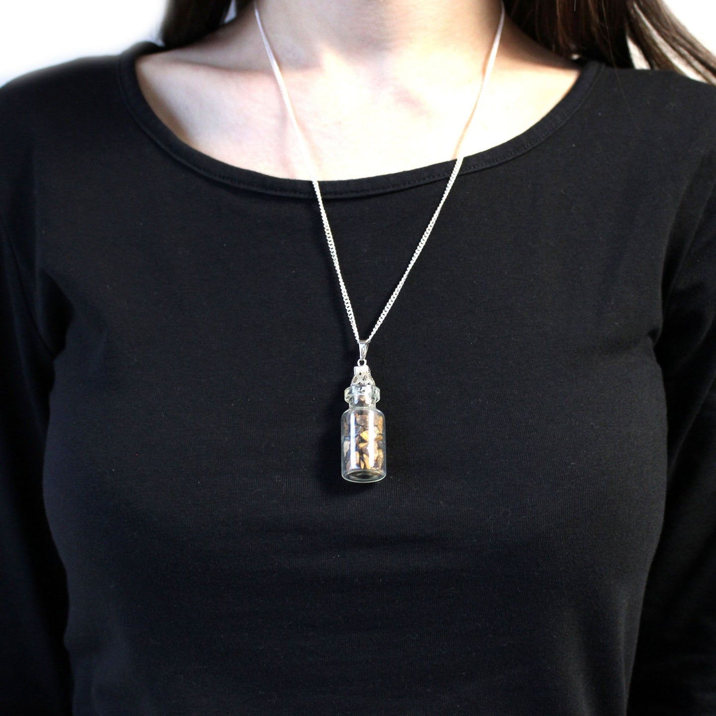 Person wearing a Bottled Gemstones Necklace - Tiger Eye