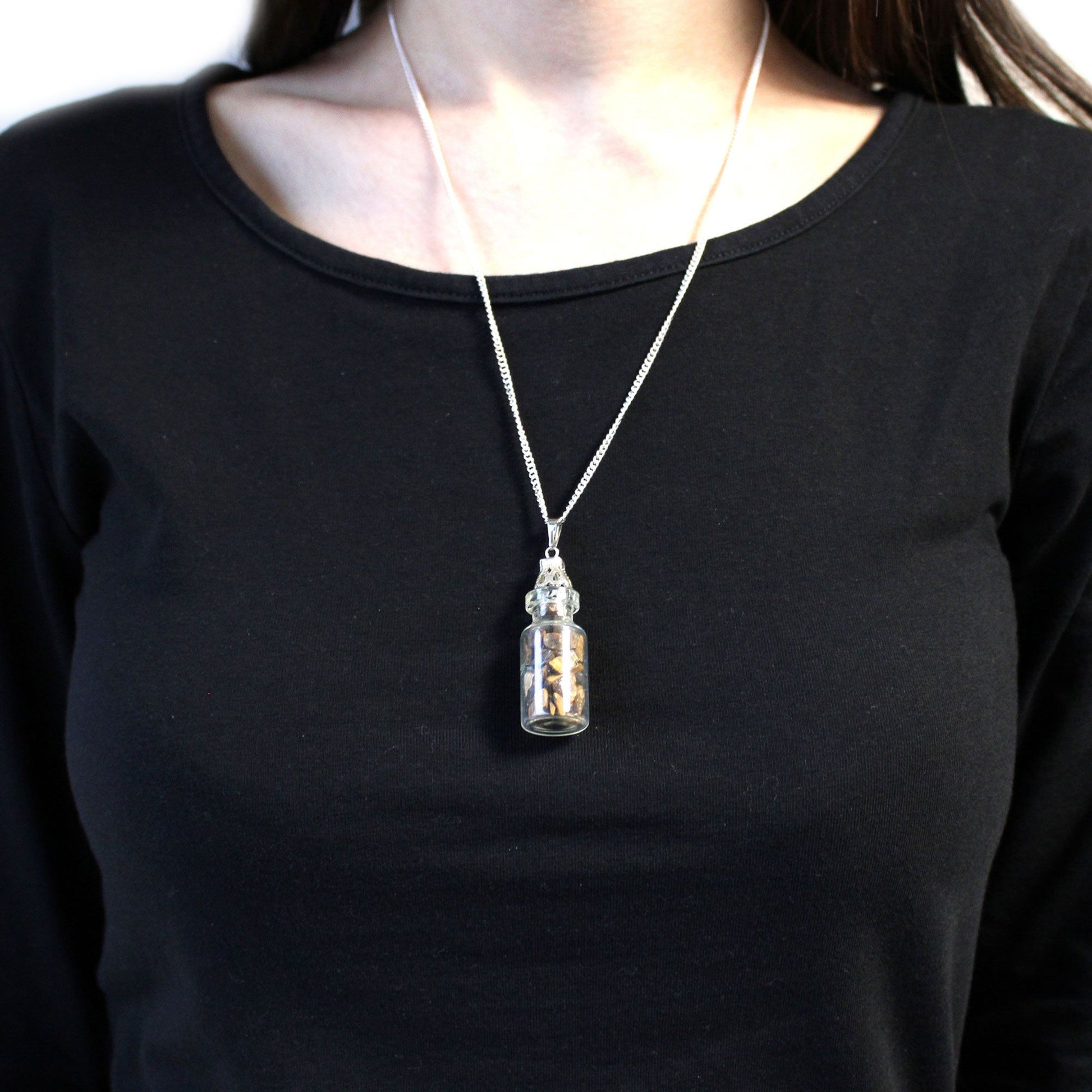 Person wearing a Bottled Gemstones Necklace - Tiger Eye