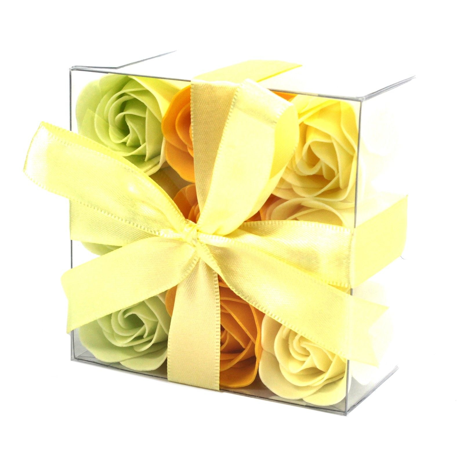 Box of spring colour soap roses with a yellow bow in clear gift box