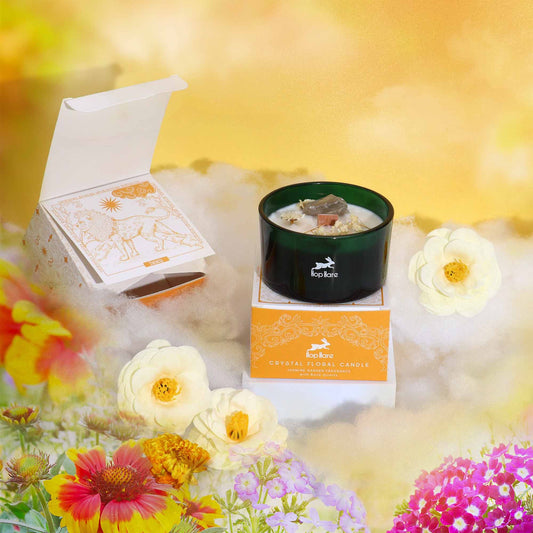 Hop Hare Crystal Magic Flower Candle - The Lion with packaging and flowers on a bright background