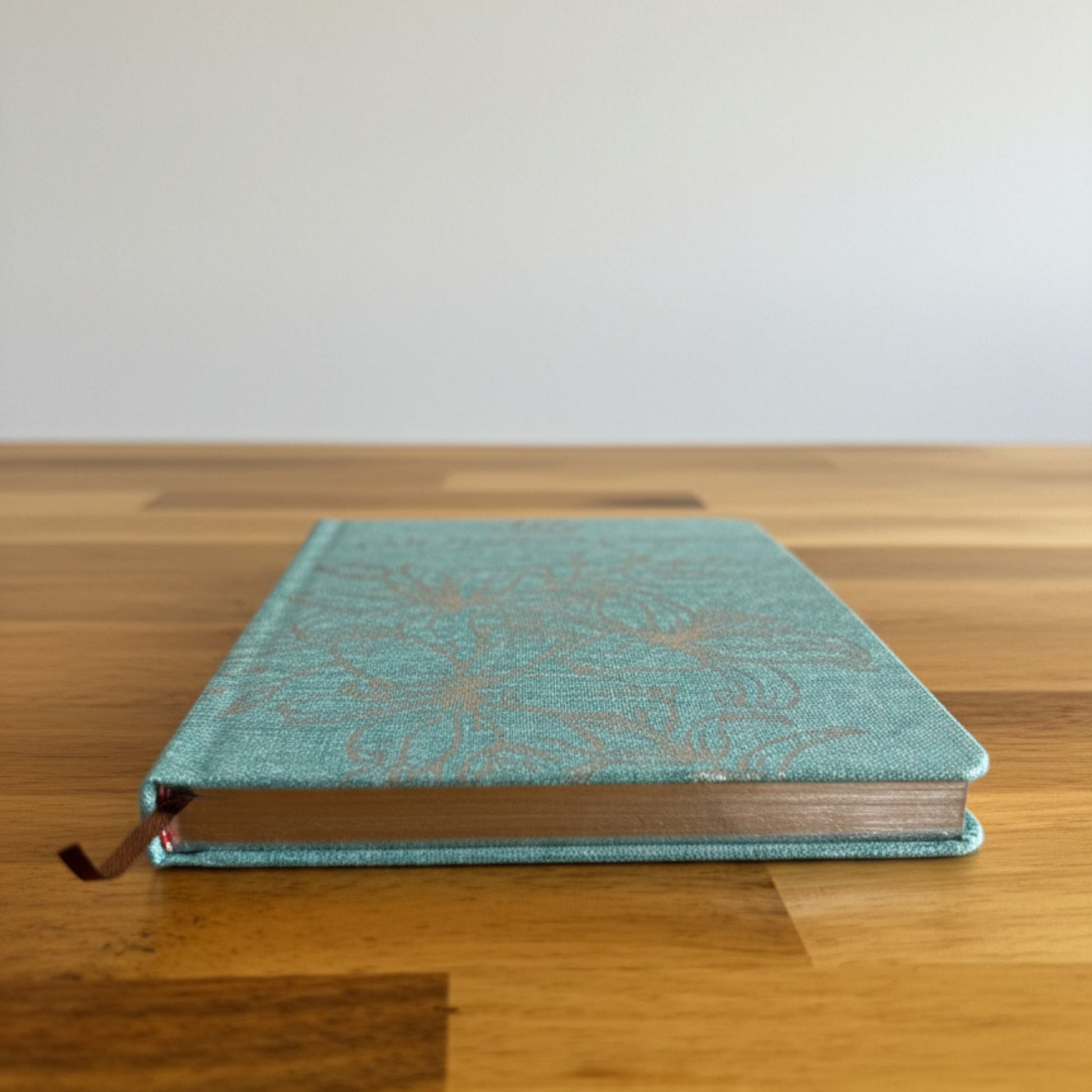 Blue Gratitude Journal with Silver Lining - 120 pages - I am Thankful For (side view showing silver lined pages)
