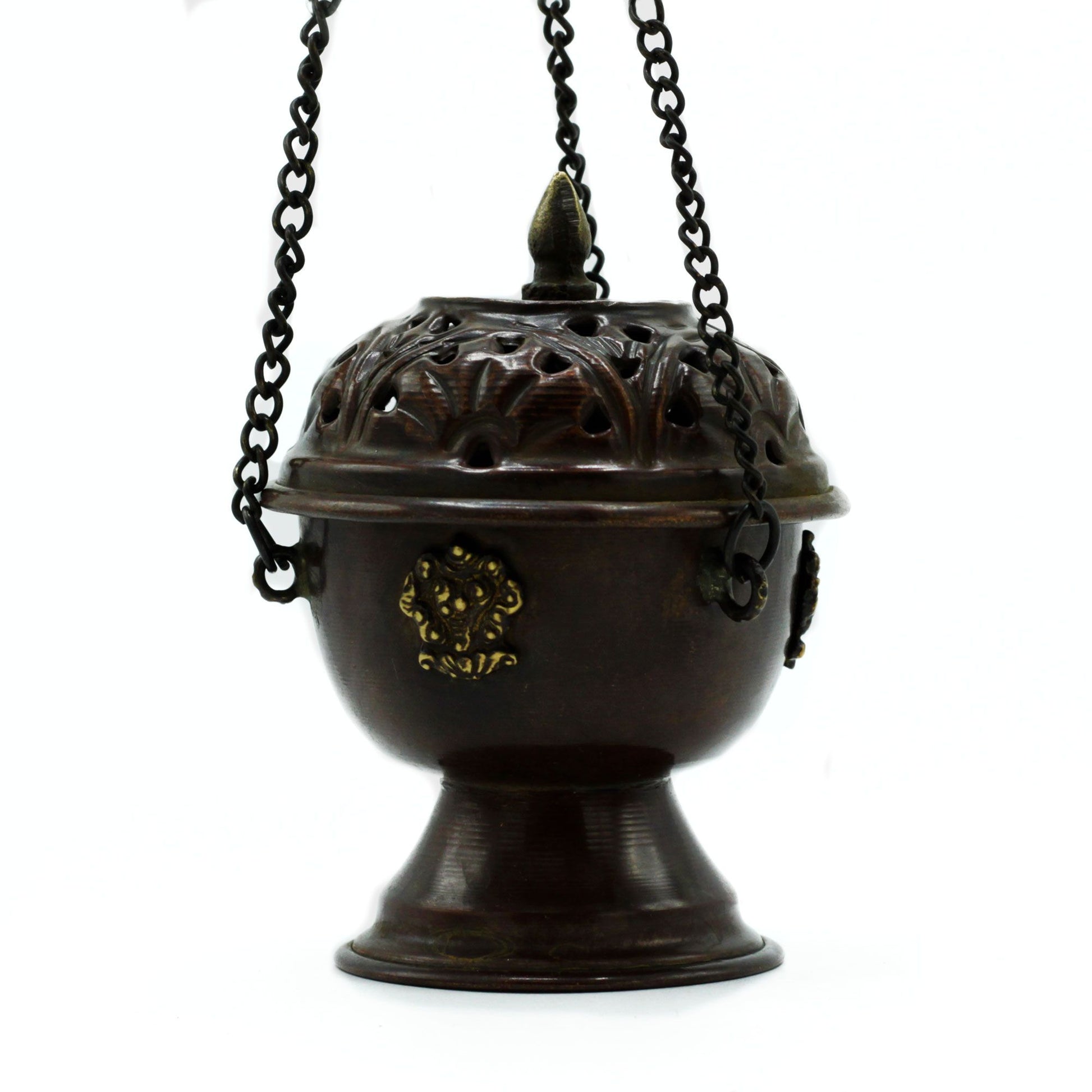 Decorative bronze incense burner with intricate designs on a white background