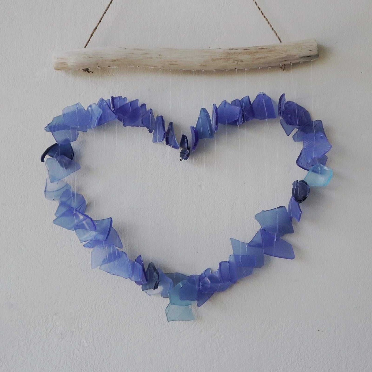 Recycled Glass Wind Chime - Blue shaped like a heart on a white background