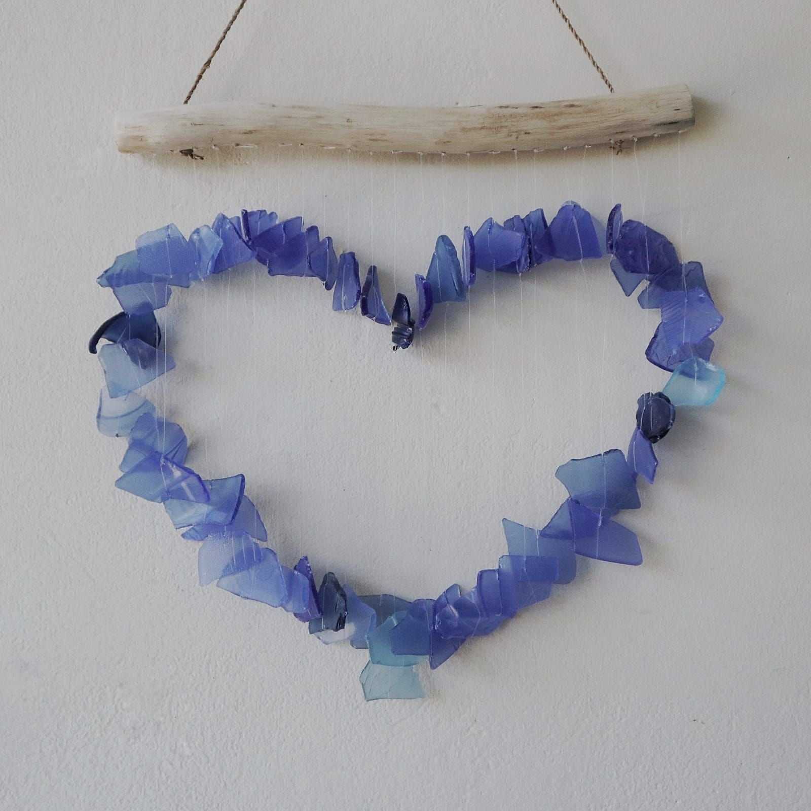 Recycled Glass Wind Chime - Blue shaped like a heart on a white background