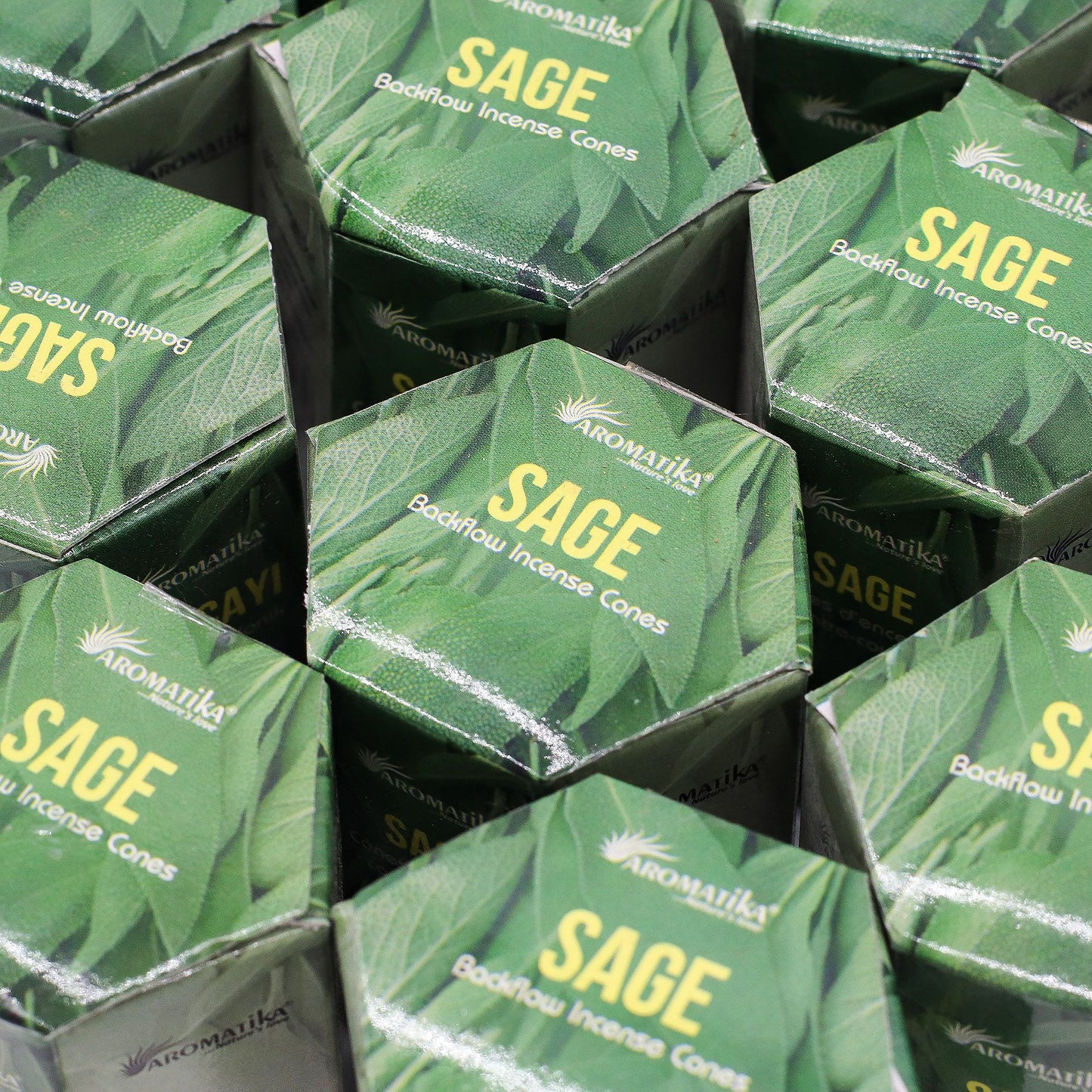 Stack of Aromatika Sage Backflow Incense Cones boxes