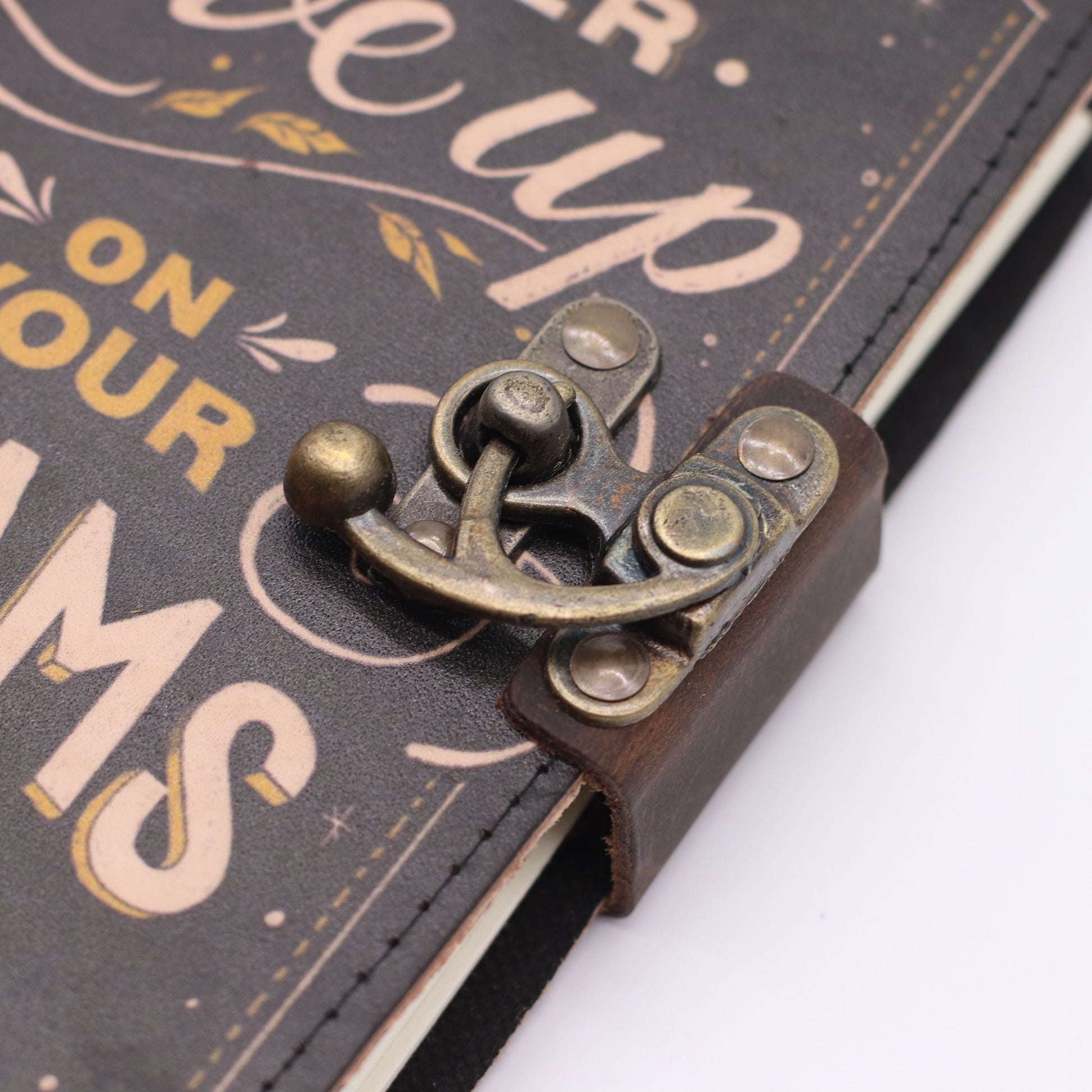 Leather Printed Notebook – Never Give Up On Your Dreams close up view of catch