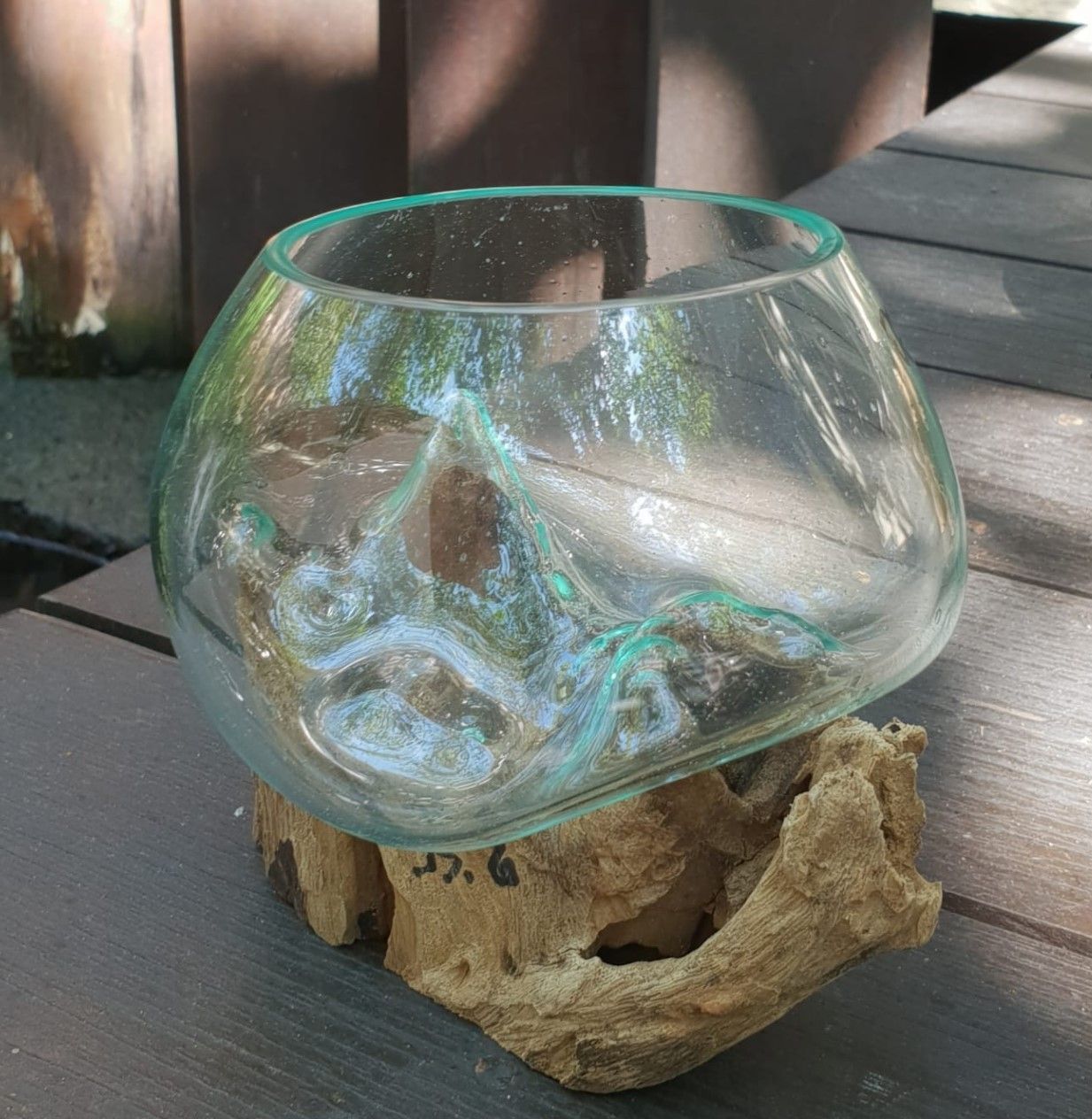molten glass bowl on a piece of gamal wood
