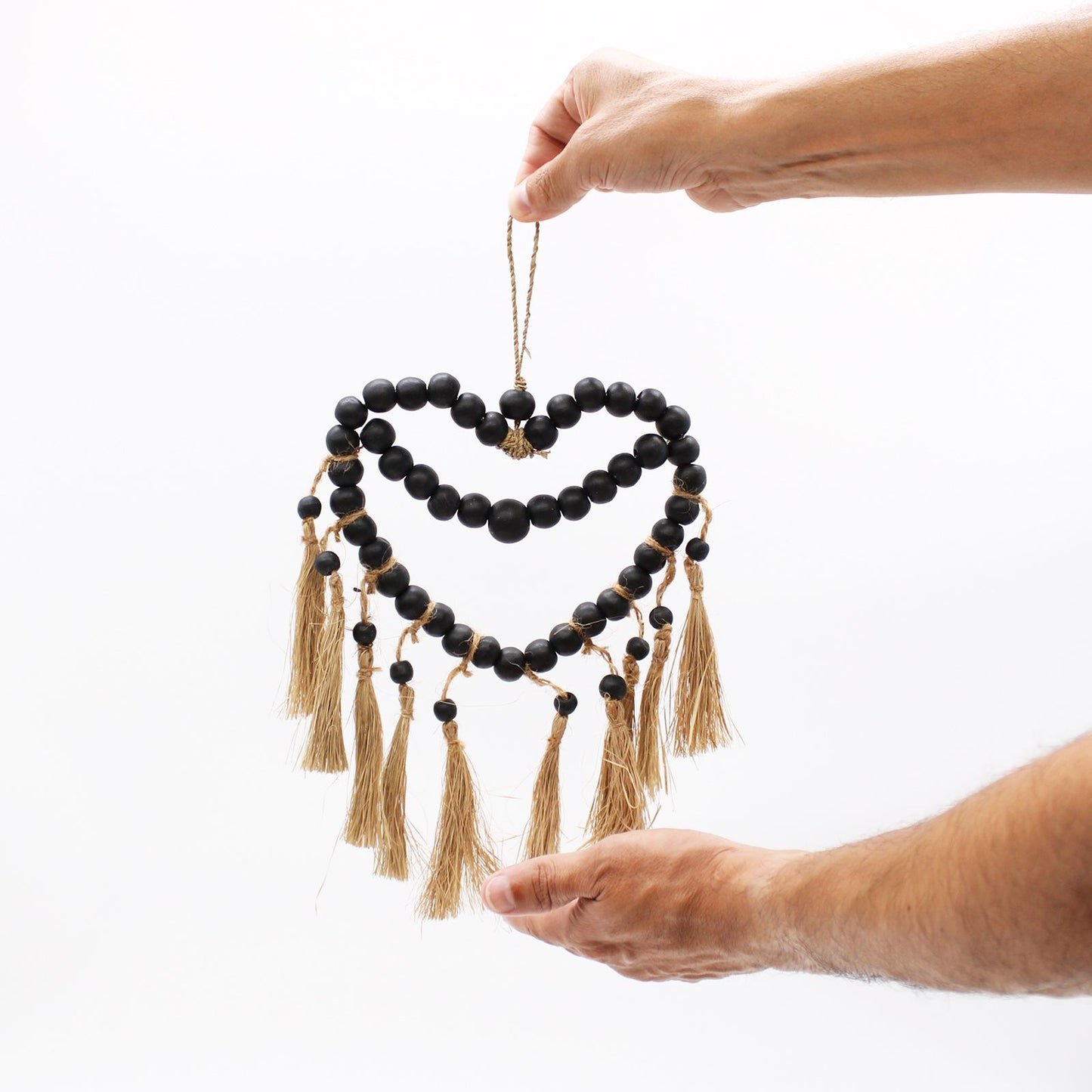 Small Bead Heart Mobile held out by two hands