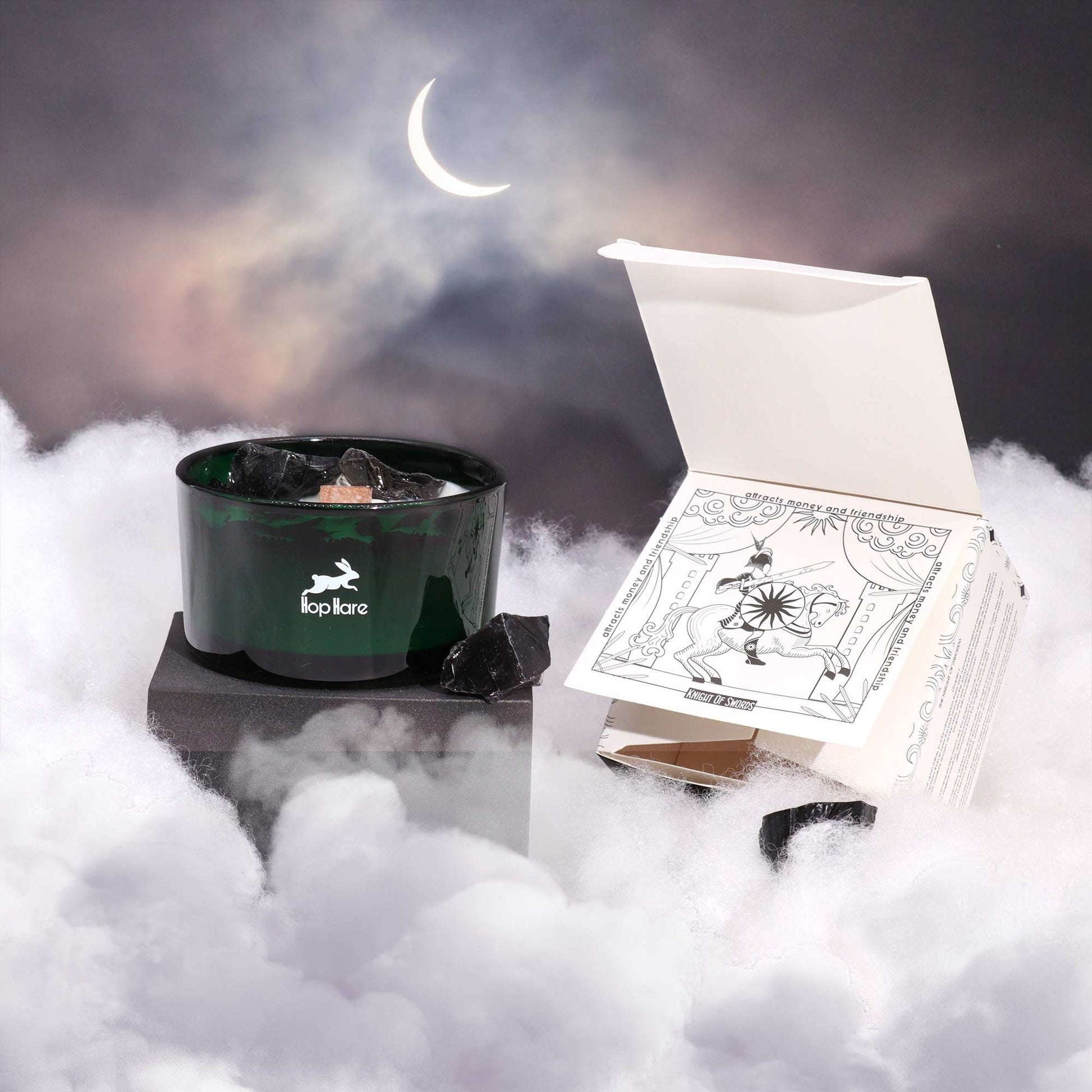 Hop Hare Crystal Magic Flower Candle - The Knight of Swords on a foggy surface with a crescent moon in the background.