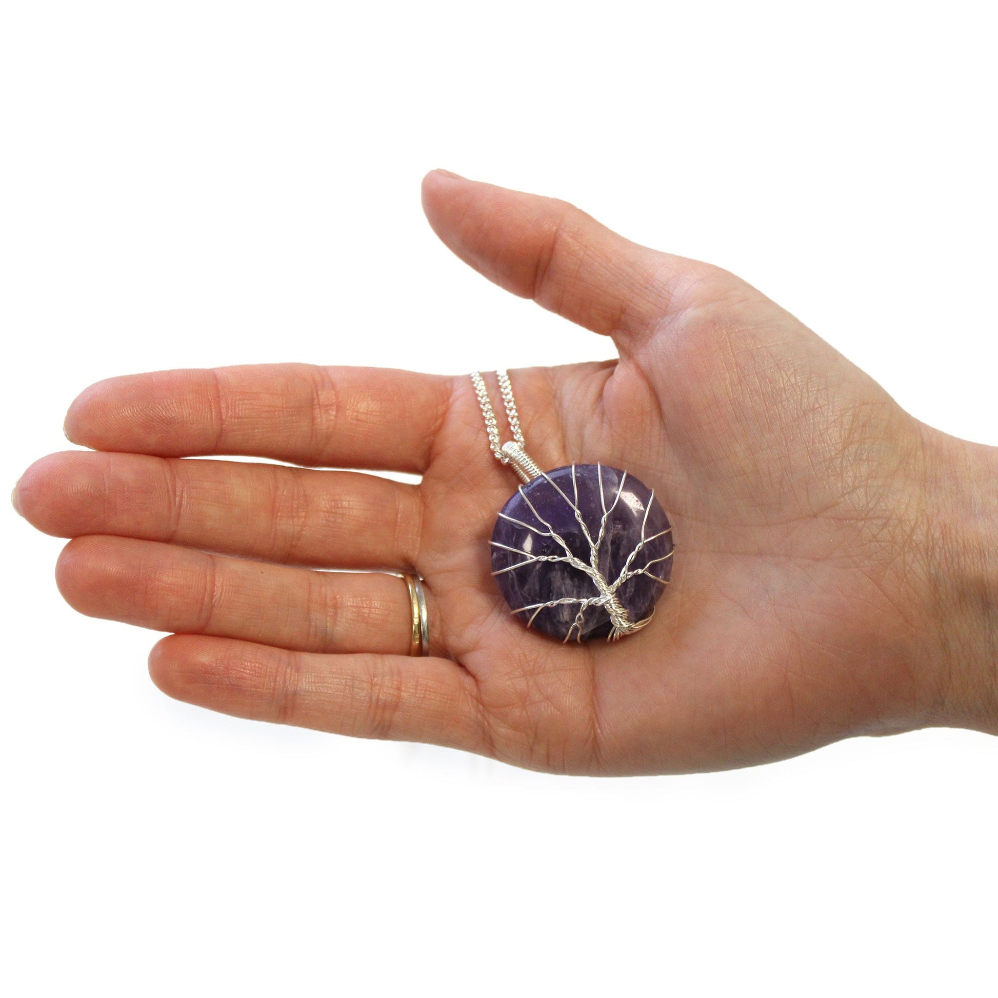 Hand holding Tree of Life Gemstone Necklace - Amethyst