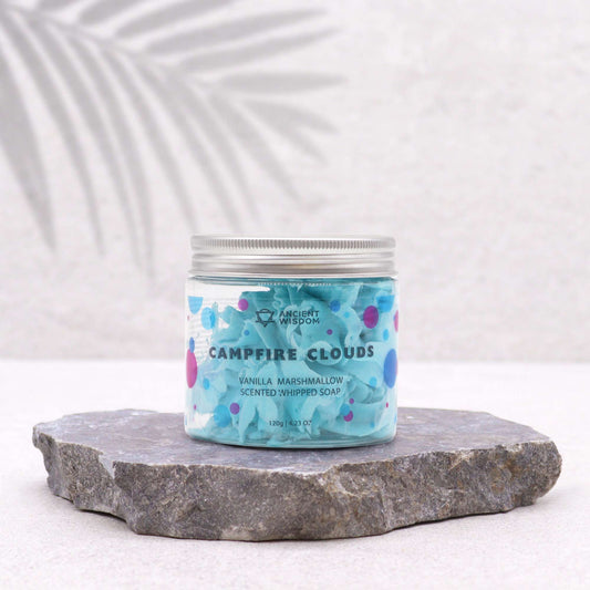 Jar of vanilla marshmallow scented whipped soap on a stone surface with a white background