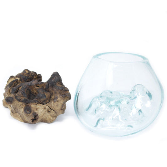 Molten glass bowl with decorative rock on a white background