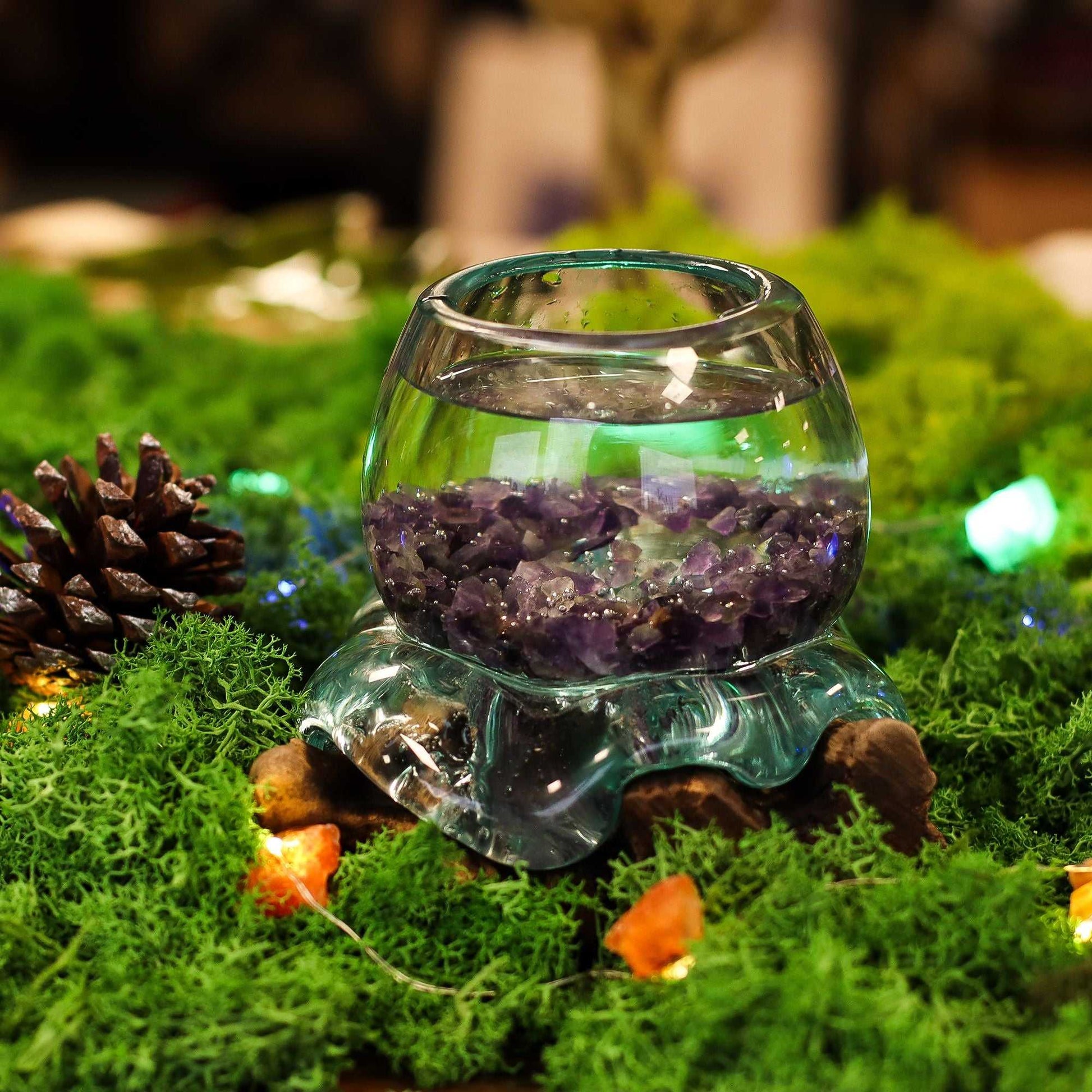 Molten Glass Mini Goldfish Bowl on Wood 20cm filled with crystals and water on a natural setting