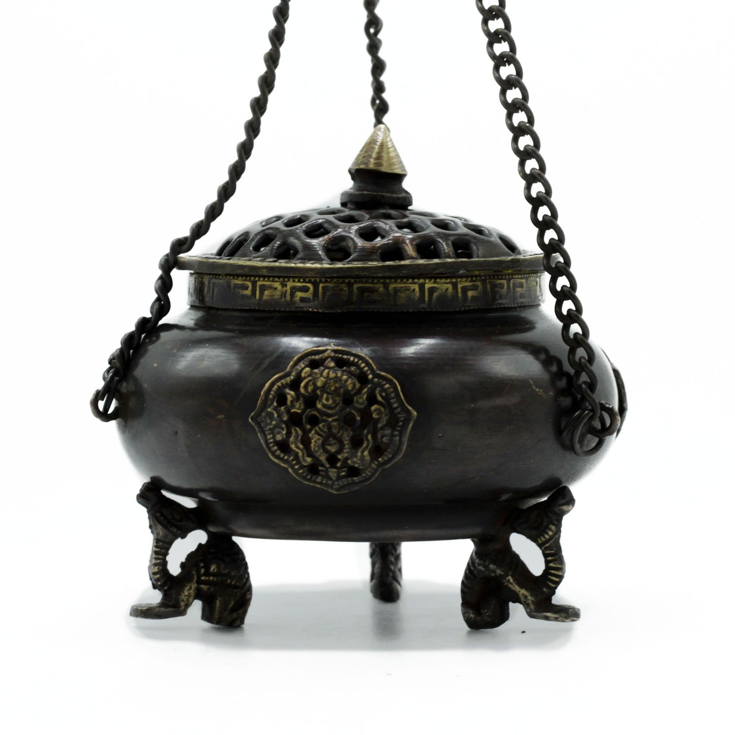 Bronze incense burner with decorative elements on a white background