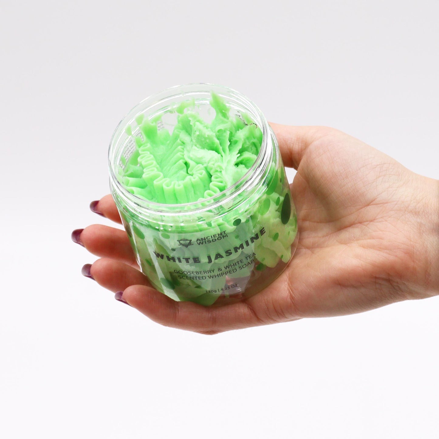 Hand holding a jar Gooseberry & White Tea Whipped Soap 120g