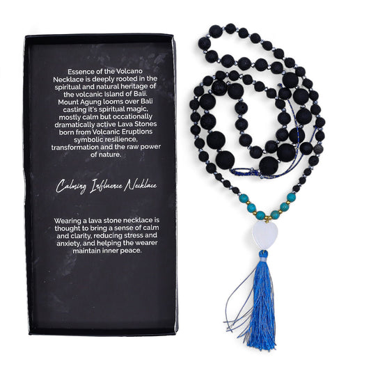 Black and blue beaded necklace with tassel next to a black card with text about the necklace.