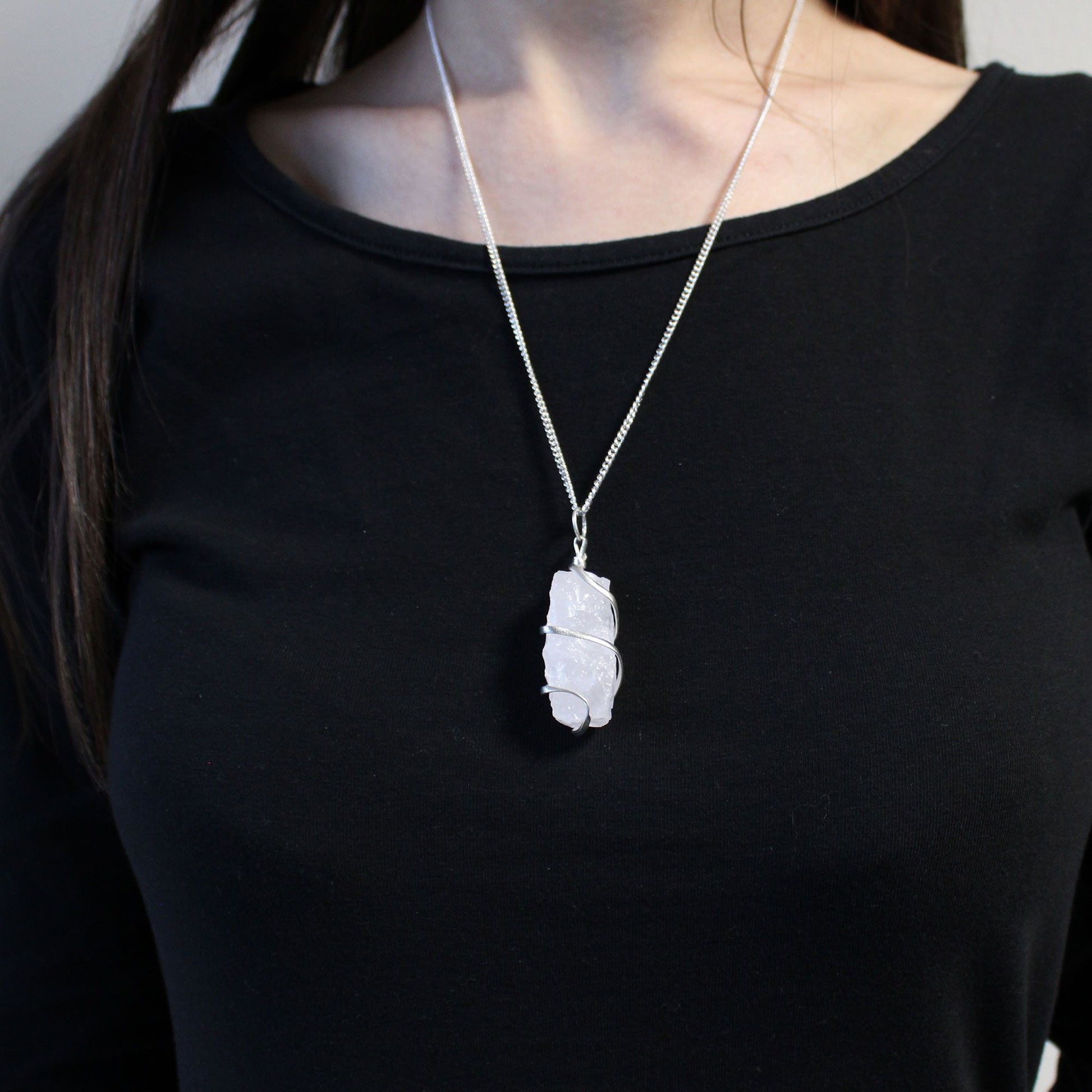 Person wearing a necklace Cascade Wrapped Gemstone Necklace - Rough Opalite
